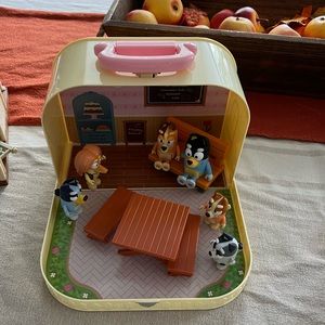Bluey figures in a cute little caring case